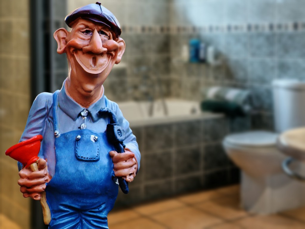 Plumbing_contractor-plumber-figurine_holding_plunger_and_pipewrench_wearing_overalls-1024x768 Plumber Insurance For Plumbing Contractors and Businesses