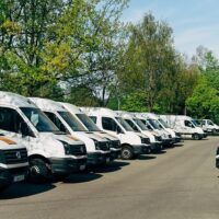 fleet of trucks parked with different insurance symbols of coverage